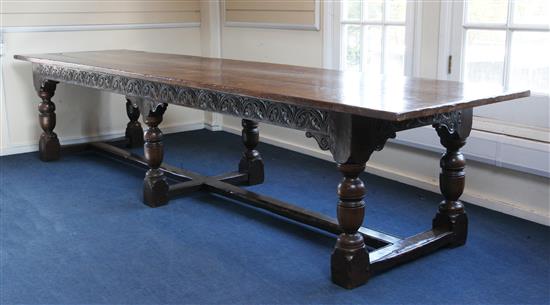 A large carved oak refectory table, 11ft 8in. x 2ft 11.5in. x 2ft 6.5in.